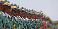 Members of the Presidential guard stand outside the new Parliament building on the day of the Zimbabwean president's the State of the Nation address in Mount Hampden, Zimbabwe, 03 October 2023. The country's main opposition party, the Citizens Coalition for Change (CCC), boycotted the address in protest to alleged irregularities during the 23 August 2023 general election.  EPA-EFE/AARON UFUMELI