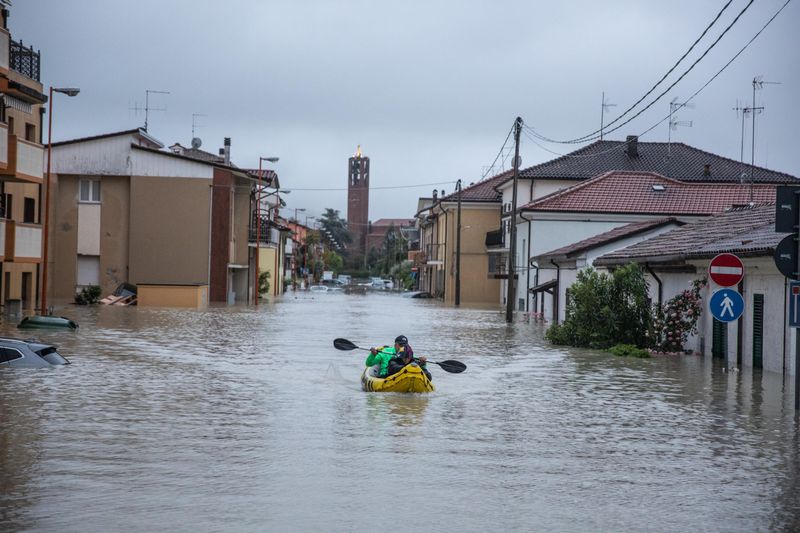 Eight dead and thousands evacuated as floods batter northern Italy