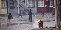 It's a heartbreaking sight as children brave the wet, freezing cold winter weather that has struck Cape Town to collect their bakkies of hot food. When there's a break in the rain, they charge across the field to take their place in the queue. (Photo: Brenton Geach)