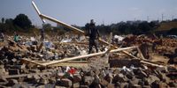 A man amid the rubble after the Red Ants demolished houses built without authorisation on the floodplains of Jukskei river in Alexandra on 2 June 2019. (Photo: Kabelo Mokoena / Sowetan / Gallo Images)