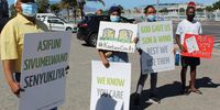 Protesters gather outside the National Nuclear Regulator office in Table View, Cape Town, on 17 February 2022, to demand transparency regarding the suspension of civil society NNR board representative Peter Becker. (Photo: Tamsin Metelerkamp)