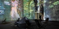 epa09211756 Visitors watch a preview of the presentation of the international exhibition 'Claude Monet: The Immersive Experience' on the eve of its opening in the 17th century San Potito church in Naples, Italy, 19 May 2021. The exhibition using latest virtual reality technology offers visitors to 'enter' the French painter Claude Monet's paintingsfor an unusual 'immersive experience'. The exhibition runs from 20 May until until 20 October 2021.  EPA-EFE/CESARE ABBATE