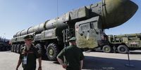 Servicemen walk past Russian strategic ballistic missile Topol launching vehicle  during the International Military-Technical Forum 'Army-2023' held at the Patriot Park in Kubinka, outside Moscow, Russia, 17 August 2023.  The International Military-Technical Forum 'Army-2023' is held from 14 to 20 August 2023 at Patriot Expo, Kubinka Air Base and Alabino military training grounds.  EPA-EFE/YURI KOCHETKOV