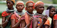 Women from the Bonda tribe stand in a queue to cast their votes during the fourth phase of India's general election, in Malkangiri district in the eastern state of Odisha, India, May 13, 2024. REUTERS/Stringer