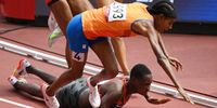 TOKYO, JAPAN - AUGUST 02: Sifan Hassan of Team Netherlands and Edinah Jebitok of Team Kenya trip and fall during round one of the Women's 1500m heats on day ten of the Tokyo 2020 Olympic Games at Olympic Stadium on August 02, 2021 in Tokyo, Japan. (Photo by Matthias Hangst/Getty Images)