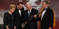 PITTSBURGH, PA - APRIL 17:  Vice President Dick Cheney inspects a flintlock rifle given to him by the National Rifle Association while he is surrounded by NRA officers Sandra Froman (L), CEO Wayne LaPierre (C), and NRA President Kayne Robinson (R) during the 133rd Annual NRA convention being held at the David L. Lawrence Convention Center on April 17, 2004 in Pittsburgh, Pennsylvania.  Cheney spoke to NRA conventioneers about the Bush administration's support of second amendment rights.  (Photo by Jeff Swensen/Getty Images)