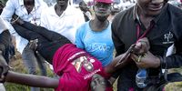 An injured supporter of Robert Kyagulanyi Ssentamu is carried away during his presidential campaign in Kampala, Uganda.(Photo: EPA-EFE / STR)
