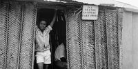 circa 1956:  A hairdresser's palm-built boutique in Ouidah, Mali advertises 'Paris mode' coiffures.  (Photo by Evans/Three Lions/Getty Images)
