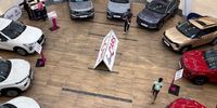 Customers browse a selection of cars displayed for sale at an entrance of a shopping mall, in Johannesburg, South Africa, August 27, 2025. REUTERS/Siphiwe Sibeko/File Photo