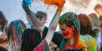 Visitors throw colored powder over each other as they attend the 9th annual festival Day of India in Moscow, Russia, 15 August 2024. The festival Day of India is a colorful celebration of Indian culture. The event kicked off on India's Independence Day and will continue until 18 August 2024. India declared its independence from British rule on 15 August 1947.  EPA-EFE/YURI KOCHETKOV