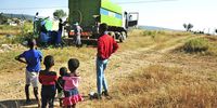 Children watch as a truck delivers water in Koppermyn section, GaMaja in Limpopo province. Government has announced plans to deliver water to communities which don't have access to running water during the Covid-19 lockdown. (Photo: Lucas Ledwaba / Mukurukuru Media)