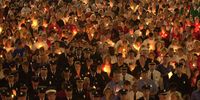 Thousands gather for a candlelight vigil remembering the victims of last year's terrorist attacks September 11, 2002 in Cincinnati, Ohio.  (Photo by Mike Simons/Getty Images)