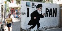 People walk next to a graffiti parodying Iran's Supreme Leader Ayatollah Ali Khamenei in Tel Aviv, Israel, 21 July 2025.  EPA/ABIR SULTAN