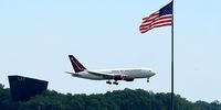An Omni Air International charter carrying the 'refugees' lands at Washington Dulles International Airport on 12 May. (Photo: Chip Somodevilla / Getty Images)