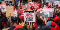 Demonstrators hold placards during the 'Occupy Bank of Ghana' protest in Accra, Ghana, on Tuesday, Oct. 3, 2023. The demonstration is the latest in Accra to protest economic hardship and perceived poor governance of the central bank. Photographer: Ernest Ankomah/Bloomberg via Getty Images