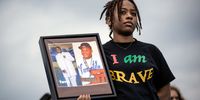 WASHINGTON, DC - JUNE 11: A demonstrator attends a March for Our Lives rally against gun violence at the base of the Washington Monument on the National Mall June 11, 2022 in Washington, DC. The March For Our Lives movement was spurred by the shooting at Marjory Stoneman Douglas High School in Parkland, Florida, in 2018. After recent mass shootings in Buffalo, New York and Uvalde, Texas, a bipartisan group of Senators continue to negotiate a potential compromise deal on gun violence and gun safety legislation. (Photo by Drew Angerer/Getty Images)
