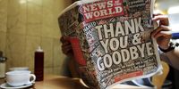 A man reads the last issue of the News of the World, published by Rupert Murdoch's News Corp., at a cafe in London, U.K., on Sunday, July 10, 2011. The U.K. tabloid that has run stories about celebrities, sex scandals and murders since the Victorian era, published its final edition after News Corp. decided to shut it amid phone-hacking claims. Photographer: Simon Dawson/Bloomberg via Getty Images
