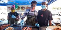Imtiaz Shaik (right) with two of his employees, Francis Makupe and Martha Vamusi. Makupe and Vamusi are both from Malawi and have been working at the market with Shaik for four years. (Photo: Ashraf Hendricks)