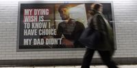 Pedestrians walk past the posters promoting the Assisted Dying bill at Westminster Underground station in London, Britain, 27 November 2024. The Assisted Dying bill is to allow adults who are terminally ill, subject to safeguards, to be assisted to end their own life. British MPs will vote on the assisted dying bill on 29 November 2024.  EPA-EFE/TOLGA AKMEN