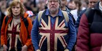 People attend a far-right march on October 26, 2024 in London, England. A protest organised by Tommy Robinson under the name Uniting the Kingdom and a counter-protest organised by Stand Up To Racism takes place in central London today. Robinson was held in custody yesterday afternoon and will miss the protest. (Photo by Jack Taylor/Getty Images)
