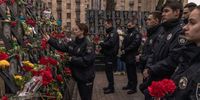 KYIV, UKRAINE - FEBRUARY 20: Members of the police pay their respects at the memorial to the Heavenly hundred heroes, who were killed in 2014 during the mass Euromaidan protests, on the Day of Remembrance of Heroes of Heavenly Hundred, on February 20, 2023 in Kyiv, Ukraine. In February 2014, the months-long Euromaidan protests culminated in violent clashes between protesters and riot police, leading to the deaths of over 100 people and the ousting of president Viktor Yanukovych, who had sparked the protests by rejecting a pact with the European Union in favor of closer ties with Russia. Nine years later, following Russia's large-scale invasion of Ukraine last year, the country again finds itself at the center of a deadly, geopolitical tussle between Russia and the West. (Photo by Roman Pilipey/Getty Images)
