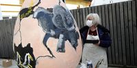 epa09077794 Painters and their students paint huge Easter eggs at Zagreb's Zoo, Zagreb, Croatia, 16 March 2021. More than ten 125 centimetres high Easter eggs will be installed around the Zoo garden. Zagreb's Zoo organised performances as announcement of Spring festival as a part of Easter customs in Croatia.  EPA-EFE/ANTONIO BAT