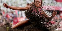 TOKYO, JAPAN - AUGUST 01:  Quanesha Burks of Team United States competes in the Women's Long Jump Qualification on day nine of the Tokyo 2020 Olympic Games at Olympic Stadium on August 01, 2021 in Tokyo, Japan. (Photo by Christian Petersen/Getty Images)
