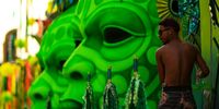 RIO DE JANEIRO, BRAZIL - FEBRUARY 19: A man works on a float prior to the samba school parade during 2023 Carnival parades at Marquês de Sapucaí Sambodrome on February 19, 2023 in Rio de Janeiro, Brazil. (Photo by Buda Mendes/Getty Images)
