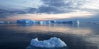 ILULISSAT, GREENLAND - SEPTEMBER 05: Icebergs which calved from the Sermeq Kujalleq glacier (BACKGROUND) float in the Ilulissat Icefjord on September 05, 2021 in Ilulissat, Greenland. 2021 will mark one of the biggest ice melt years for Greenland in recorded history. Researchers from Denmark estimated that in July of this year enough ice melted on the Greenland Ice Sheet to cover the entire state of Florida with two inches of water. According to NASA, Greenland has melted 5 trillion tons of ice over approximately the past 15 years, enough to increase global sea level by nearly an inch. The observations come on the heels of the recent United Nations report on global warming which stated that accelerating climate change is driving an increase in extreme weather events. (Photo by Mario Tama/Getty Images)