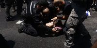 Police arrest a demonstrator during a protest against the government's plans to overhaul the justice system in Tel Aviv, Israel, on Tuesday, July 11, 2023. Israelis have taken to the streets en masse to protest the government's plans to weaken the power of judges. Photographer: Kobi Wolf/Bloomberg via Getty Images