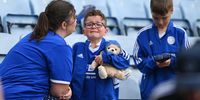 A young Leicester fan is comforted by his mother after the clubs relegation following the Premier League match between Leicester City and West Ham United at The King Power Stadium on May 28, 2023 in Leicester, England. (Photo by Michael Regan/Getty Images)