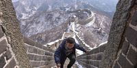 BEIJING, CHINA - FEBRUARY 23:  A Chinese tourist visits the Mutianyu Great Wall covered in snow on February 23, 2021 in Beijing, China. Affected by the new coronavirus (COVID-19), the number of visitors to Mutianyu Great Wall in 2020 dropped by about 60%.  (Photo by Lintao Zhang/Getty Images)