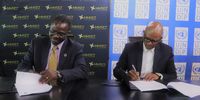 From left: Dr Ayodele Odusola, the UNDP’s former representative in South Africa, and Lehlogonolo Masoga, MMSEZ chief executive, sign the MOU. (Photo: UNDP/MMSEZ press announcement)
