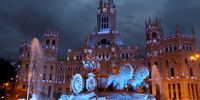 epa09365602 Plaza Cibeles lights up to celebrate UNESCO adding Madrid's historic Paseo del Prado boulevard and Retiro Park to its list of world heritage sites, in Madrid, Spain, 25 July 2021. Unesco World Heritage list committee decided the candidacy 'Landscape of Light', made up of the Paseo del Prado and the Buen Retiro park, would access the catalog in the category of the cultural landscape.  EPA-EFE/Kiko Huesca