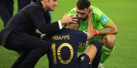 epaselect epa10372878 French President Emmanuel Macron (L) comforts Kylian Mbappe of France after the penalty shoot-out of the FIFA World Cup 2022 Final between Argentina and France at Lusail stadium, Lusail, Qatar, 18 December 2022.  EPA-EFE/Friedemann Vogel