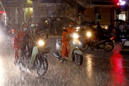 Tropical storm Podul drenches southern China
