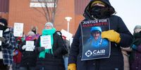 Protesters gather a few blocks from where Alex Pretti was fatally shot by federal agents on 24 January 2026. (Photo: Craig Lassig / EPA)</p>
<p>