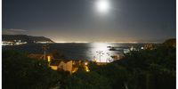 Full moon over False Bay, Simonstown. Photographer: John Maskew