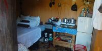 A bed and pots inside the shack where Nokuthula Mabaso was living before she was murdered in the Khenana informal settlement on 5 May 2022. (Photo: Phumlani Thabethe)