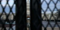WASHINGTON, DC - JANUARY 14: A member of the New York National Guard stands watch along the 7-foot 'non-scalable' fence that surrounds the U.S. Capitol the day after the House of Representatives voted to impeach President Donald Trump for the second time January 14, 2021 in Washington, DC. Thousands of National Guard troops have been activated to protect the nation's capital against threats surrounding President-elect Joe Biden’s inauguration and to prevent a repeat of last week’s deadly insurrection at the U.S. Capitol. (Photo by Chip Somodevilla/Getty Images)