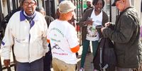 Operation Dudula members outside Itereleng Clinic  in Soweto check passports and IDs on 16 July 2025. Operation Dudula has been turning away foreign nationals from accessing healthcare services at public clinics. (Photo: Gallo Images / Fani Mahuntsi)