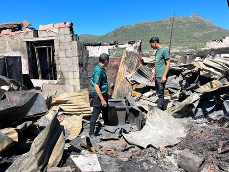 Hundreds displaced after string of flames rips through Cape Town informal settlements
