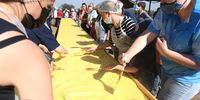 PRETORIA, SOUTH AFRICA - SEPTEMBER 24: The Voortrekkers' Pulse Commando put together a milk tart that is 12 meters long to celebrate Heritage Day  on September 24, 2021 in Pretoria, South Africa.  This giant pie required almost 120 litres of milk and more than a kilogram of cinnamon to prepare. (Photo by Gallo Images/Deaan Vivier)