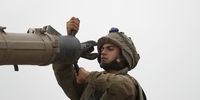 An Israeli soldier inspects military equipment as they gather at an area next to the border with Gaza, southern Israel, 09 October 2023. The Israeli army announced on 09 October, it carried out over 500 strikes on targets across the Gaza Strip overnight. Palestinian officials said almost 500 people were killed, including 91 children, and over 2,700 were injured after Israel launched retaliatory raids and air strikes in the Palestinian enclave. An unprecedented attack on southern Israel on 07 October claimed by the Islamist movement Hamas killed more than 700 Israelis and left over 2,150 injured, the Israeli army said.  EPA-EFE/ATEF SAFADI