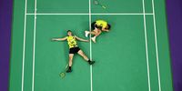 PARIS, FRANCE - AUGUST 04:  (EDITORS NOTE: Image was captured using a robotic camera positioned above the field of play.) Yang Lee and Chi-Lin Wang of Team Chinese Taipei celebrate victory during the Badminton Men's Doubles Gold Medal match against Chang Wang and Wei Keng Liang of Team People’s Republic of China on day nine of the Olympic Games Paris 2024 at Porte de La Chapelle Arena on August 04, 2024 in Paris, France. (Photo by Rob Carr/Getty Images)