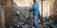 Residents are forced to live among the rubbish. (Photo: Bheki Simelane)