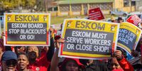 Workers carrying placards as they march from King William’s Town to the Eastern Cape Premier’s Office in Bhisho on 24 August 2022. ( Photo: Hoseya Jubase)
