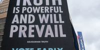 A sign reading "Truth Is Powerful And Will Prevail" near an early voting polling location for the 2020 Presidential election at Capital One Arena in Washington, D.C., U.S., on Tuesday, Oct. 27, 2020. More Americans have voted early already than did before the 2016 election with 59.4 million people having cast ballots in-person at early voting centers or by mail, according to the U.S. Elections Project on Monday. Photographer: Stefani Reynolds/Bloomberg via Getty Images
