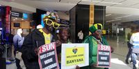 Fans awaiting the arrival of Banyana Banyana at OR Tambo International Airport hold placards with messages of support. Photo by Yanga Sibembe