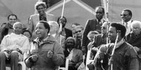 Circa 1990. South African, Chris Hani, was the leader of the South African Communist Party and Umkhonto we Sizwe, the armed wing of the African National Congress (ANC). He was a fierce opponent of the apartheid government. Here he is toyi-toying at a SACP rally. In the background Nelson Mandela, Walter Sisulu, Joe Slovo, Ronnie Kasrils and other dignitaries can be seen. (Photo: City Press\Gallo Images)